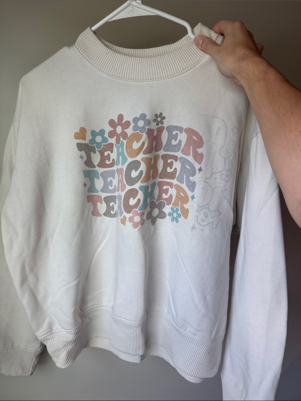 White Sweatshirt with Pastel 'Teacher' Graphic
